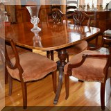 F07. Banded mahogany double pedestal dining table. 